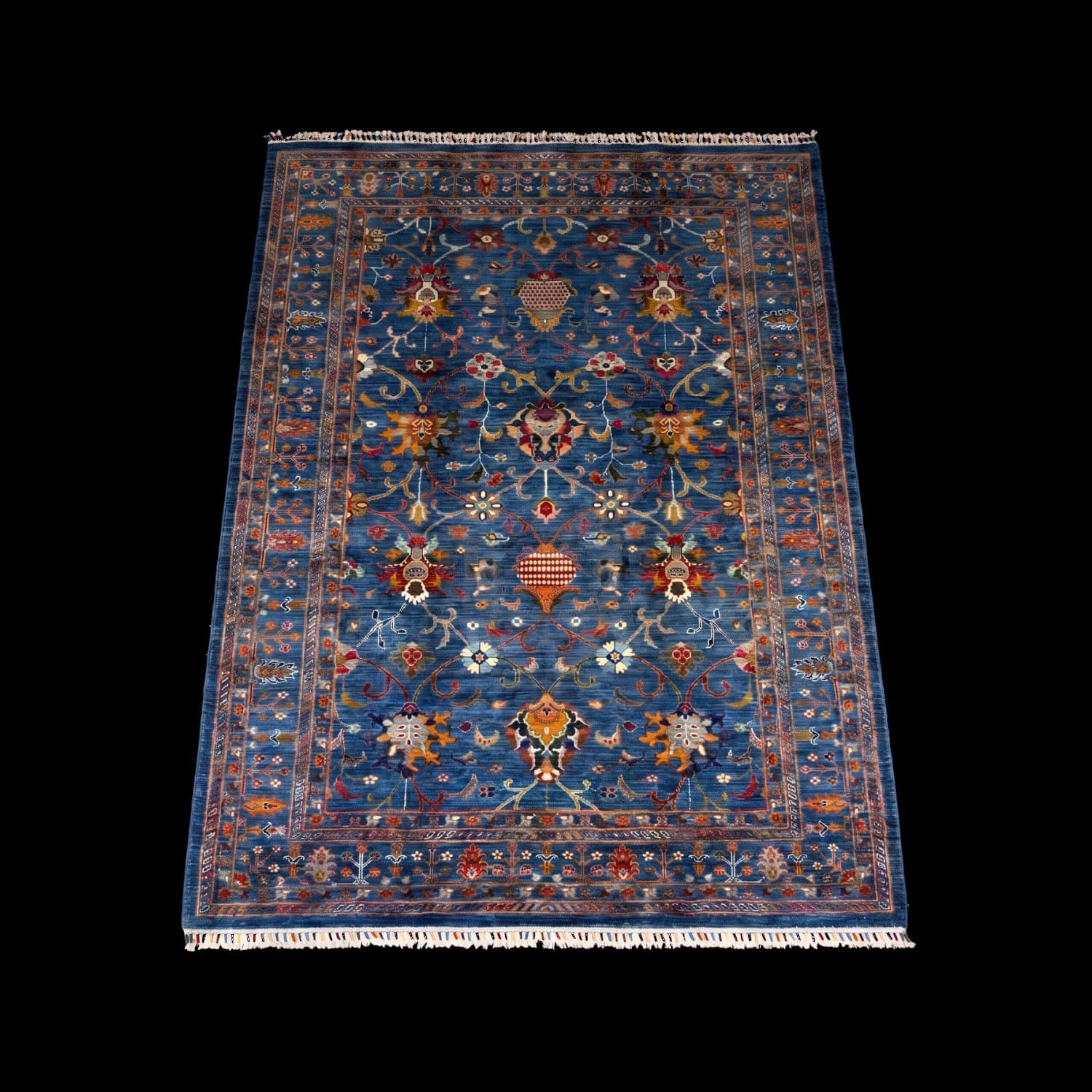 The same blue rug photographed with the light from a different side — Light from the front