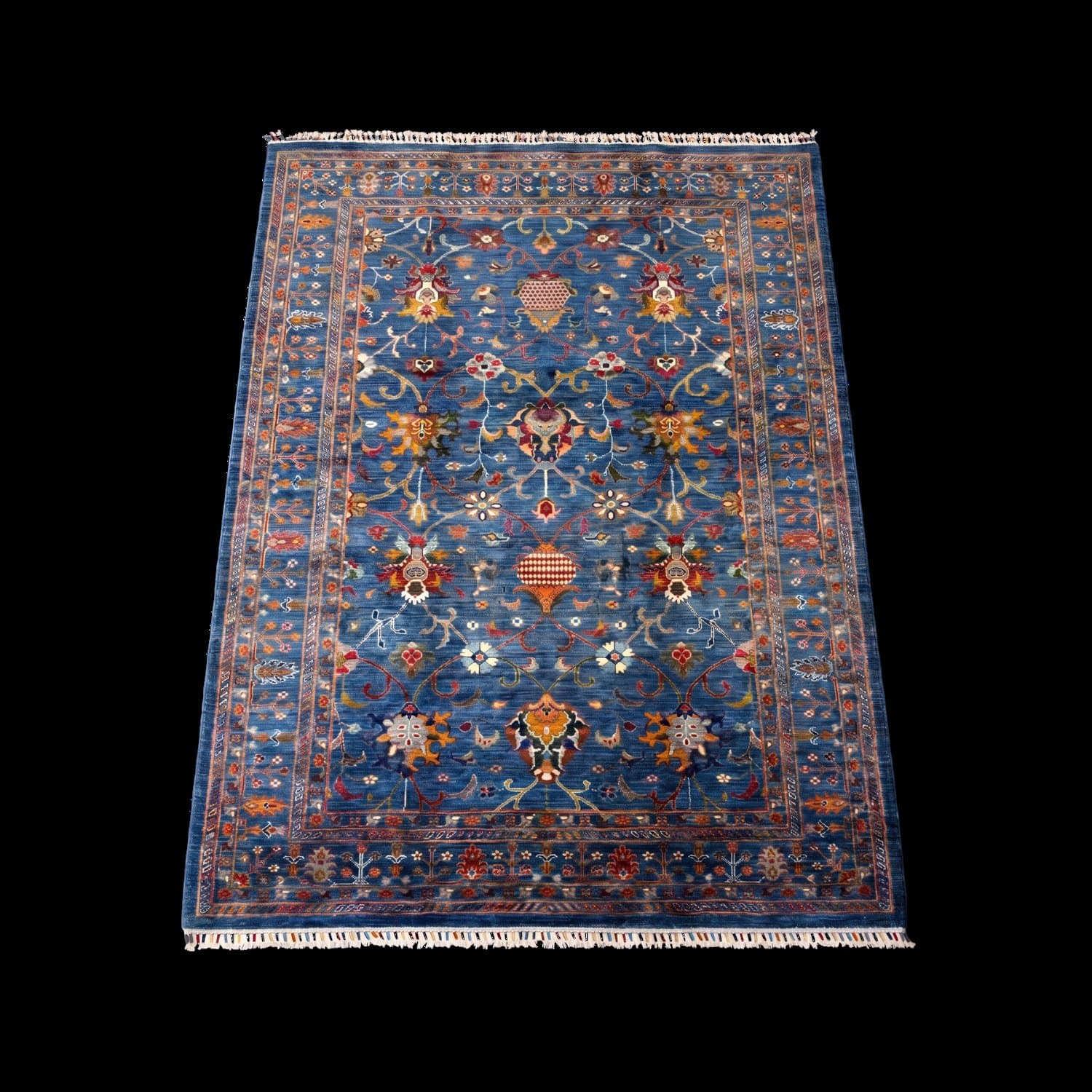 The same blue rug photographed with the light from a different side — Light from the left